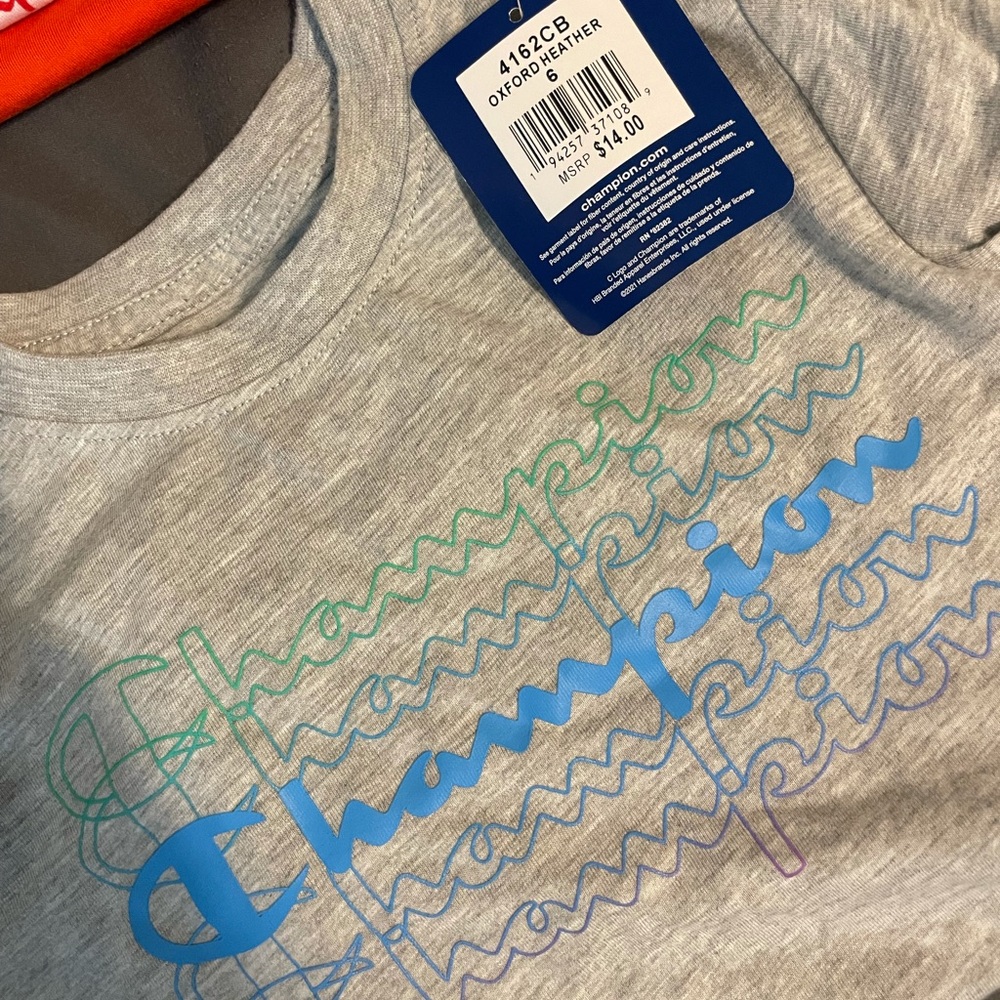 Grey champion kids shirt with blue and green logo